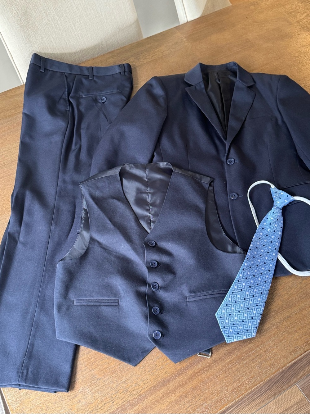Andrew Fezza boy’s  Navy Three-Piece Suit with Blue Patterned Tie